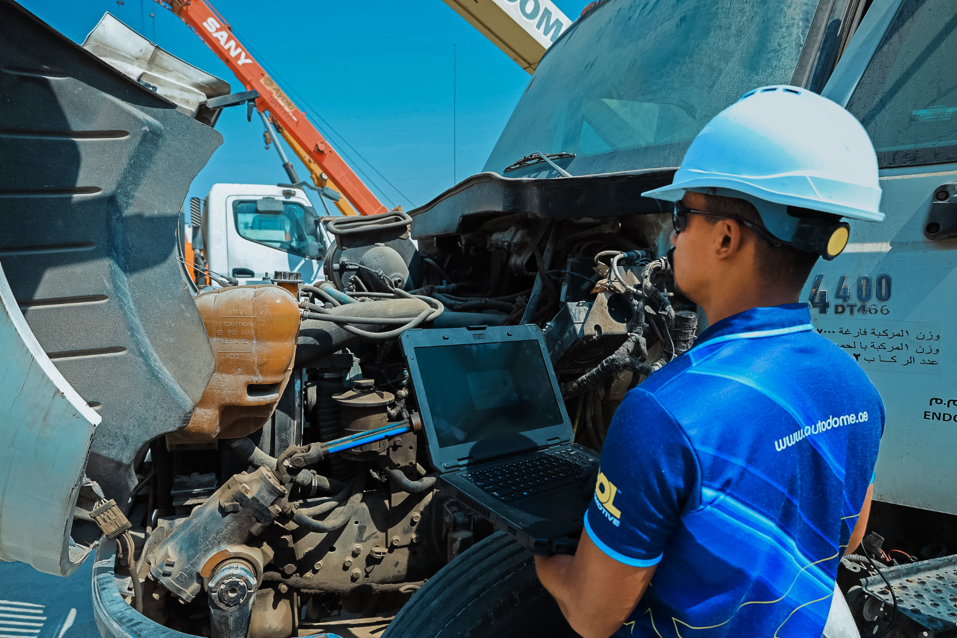 Technician diagnosing a heavy-duty commercial vehicle engine